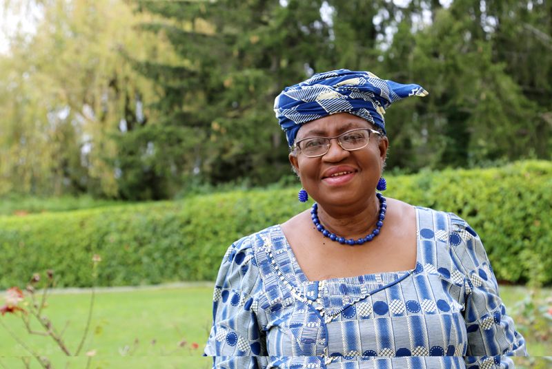 Okonjo-Iweala poses outside a Nigerian diplomatic residence in Chambesy