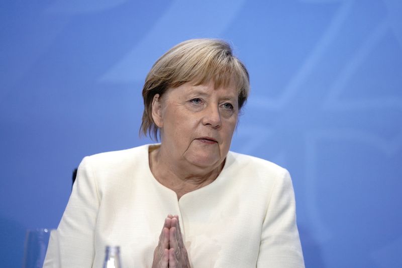 German Chancellor Angela Merkel attends a press conference after a
