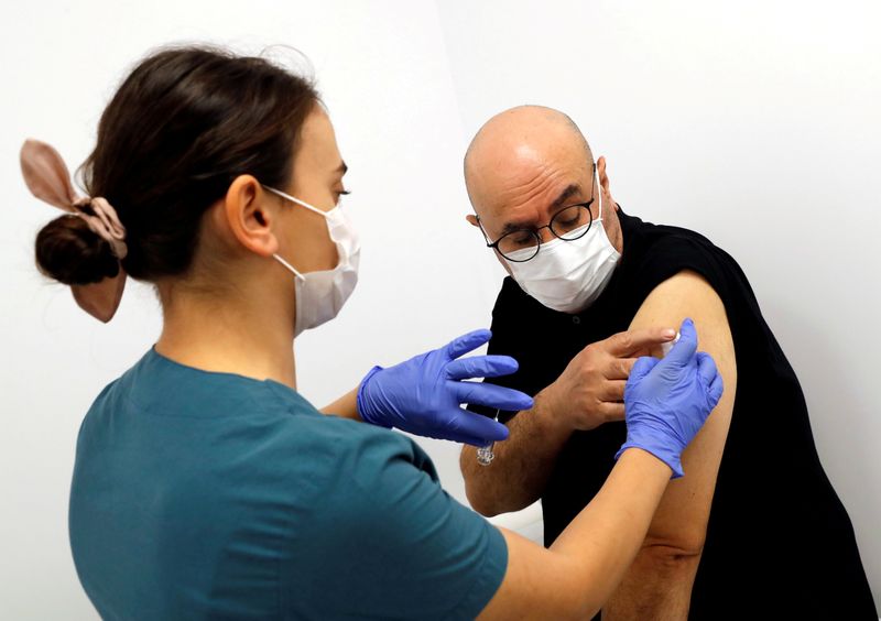 FILE PHOTO: A volunteer is injected an experimental Chinese coronavirus