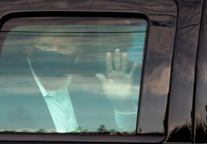 U.S. President Donald Trump waves to supporters outside of Walter
