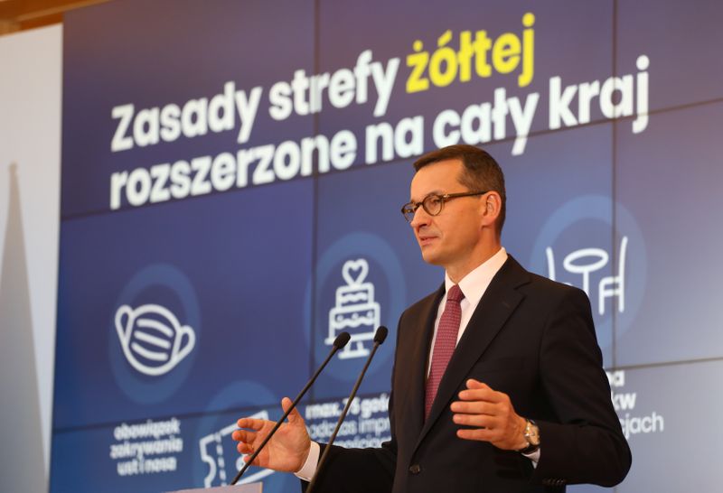 Poland’s Prime Minister Morawiecki speaks during a news conference in