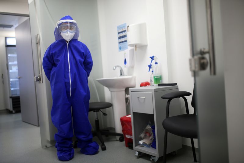 FILE PHOTO: A nurse wearing protective gear is seen inside