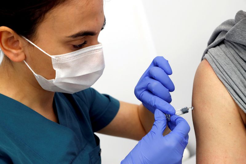 FILE PHOTO: A volunteer is injected with an experimental Chinese