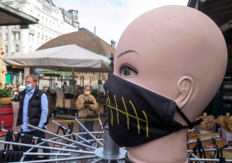 A protective face mask is on display at a market
