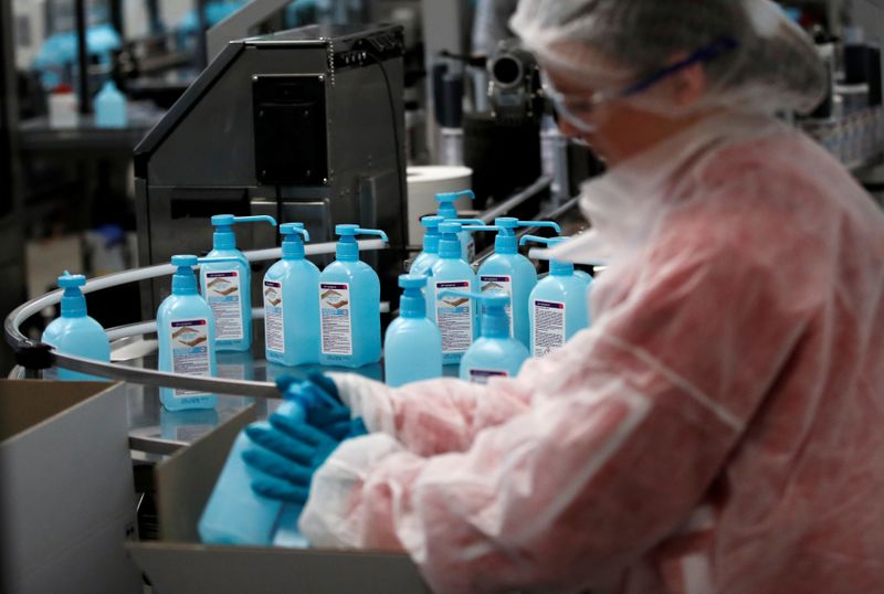 FILE PHOTO: An employee works on the production of hydroalcoholic