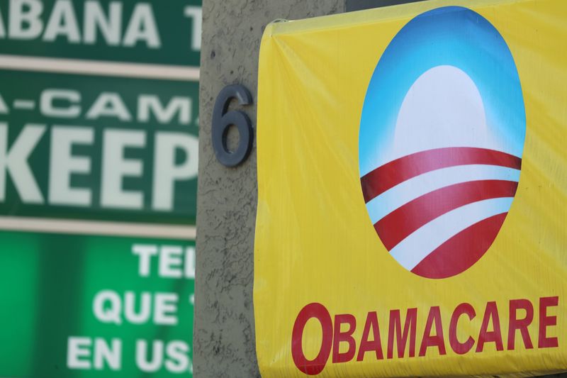 A sign on an insurance store advertises Obamacare in San