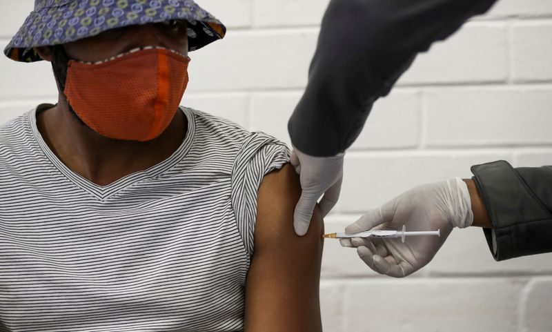 FILE PHOTO: A volunteer receives an injection from a medical