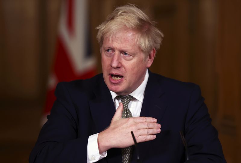 Britain’s PM Johnson attends a news conference in London