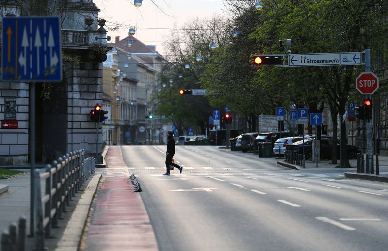 A man crossing a street as Croatia is stepping up