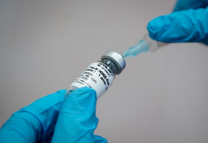 A nurse prepares Russia’s “Sputnik-V” vaccine against the coronavirus disease