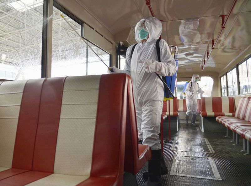 A trolley bus is disinfected amid fears over the spread