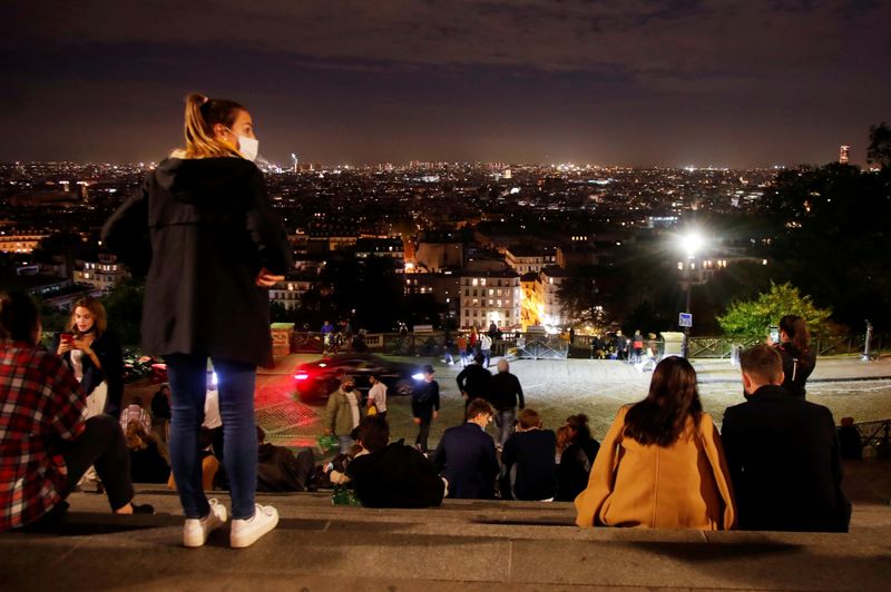 FILE PHOTO: People enjoy the view from Montmartre a few
