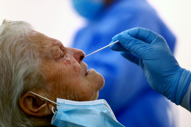 FILE PHOTO: A woman has a swab sample taken for
