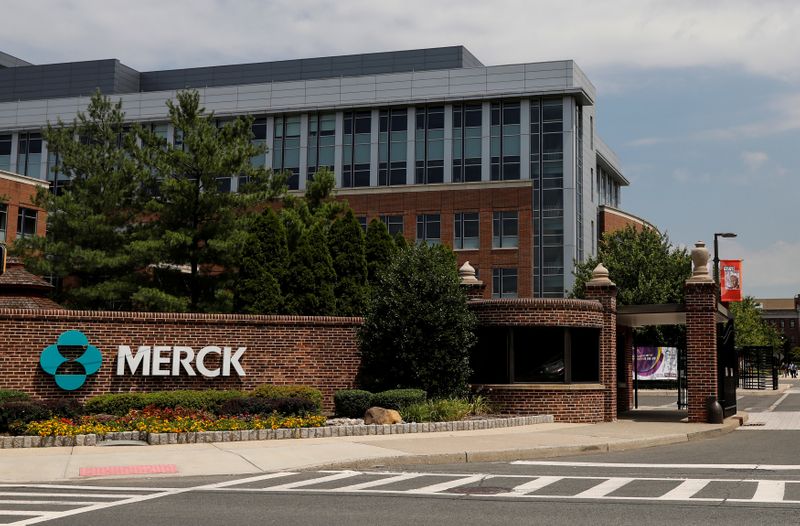 The Merck logo is seen at a gate to the