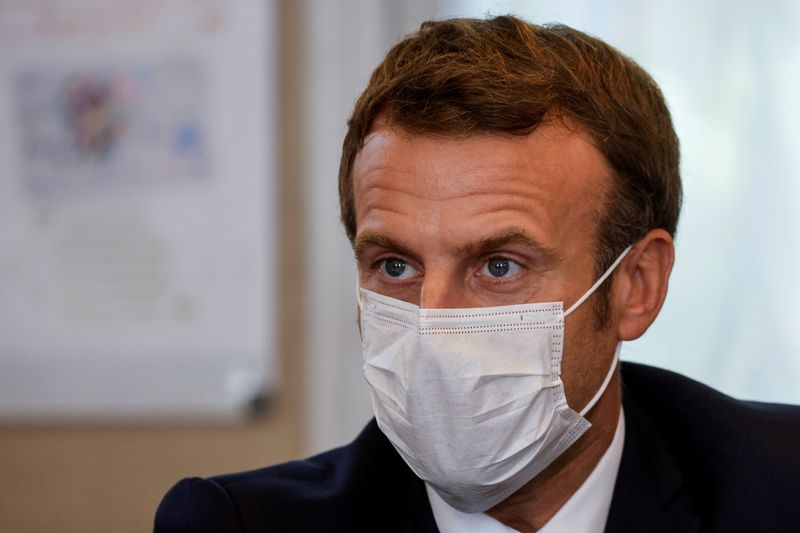 FILE PHOTO: French President Macron meets with medical staff in