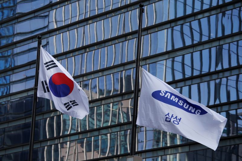 A flag bearing the logo of Samsung flutters at half-mast