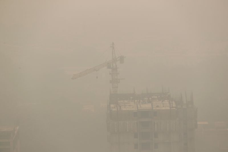 Buildings are seen shrouded in smog in New Delhi