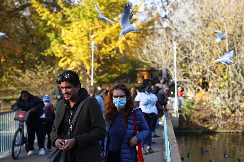 People walk through St James Park amid the coronavirus disease