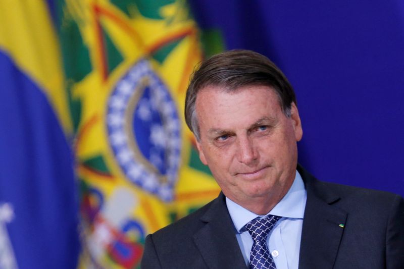 Brazil’s President Jair Bolsonaro looks on during a ceremony at