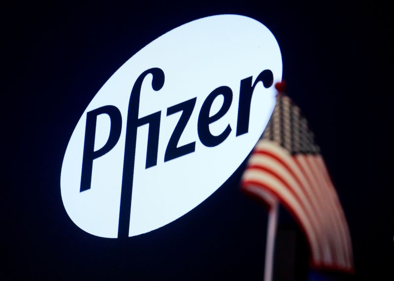 FILE PHOTO: A logo for Pfizer is displayed on a