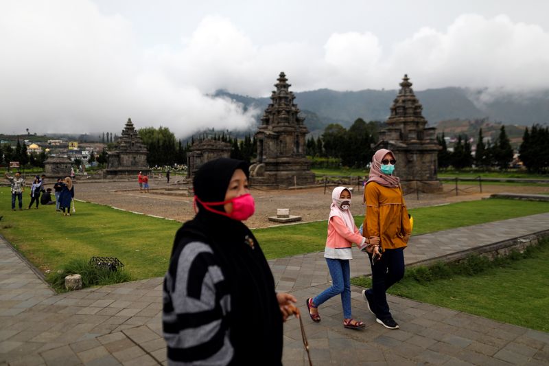 Visitors wearing protective masks following the coronavirus disease (COVID-19) outbreak