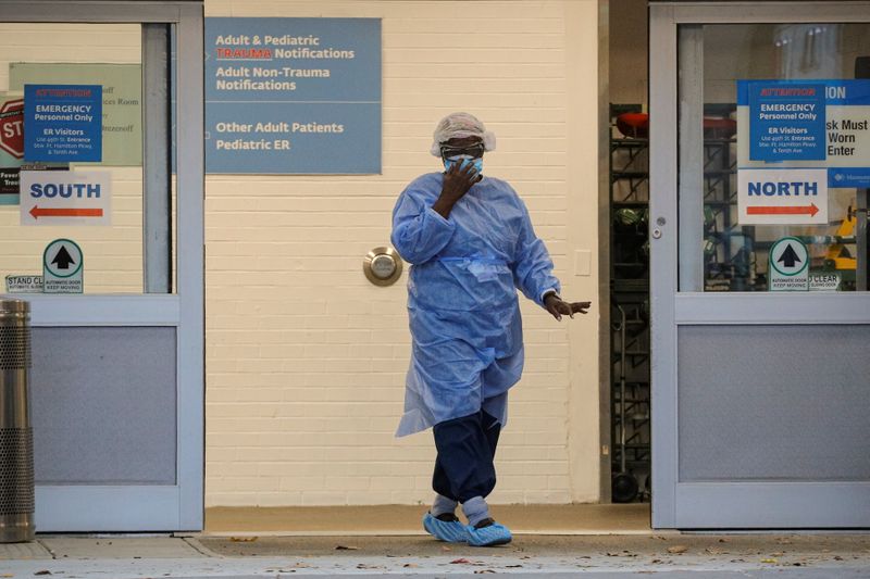 A doctor exits the emergency door outside Maimonides Medical Center,