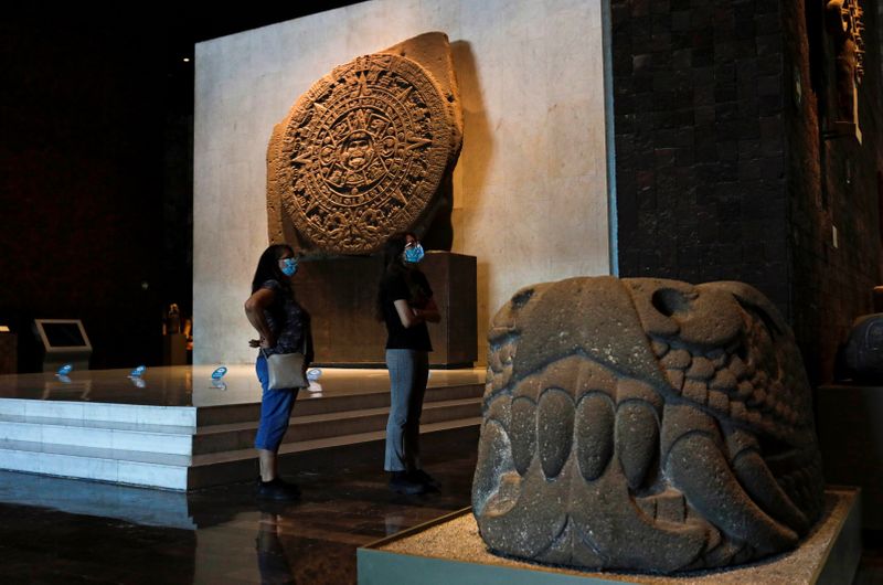 FILE PHOTO: People stand next to at the Aztec Sun