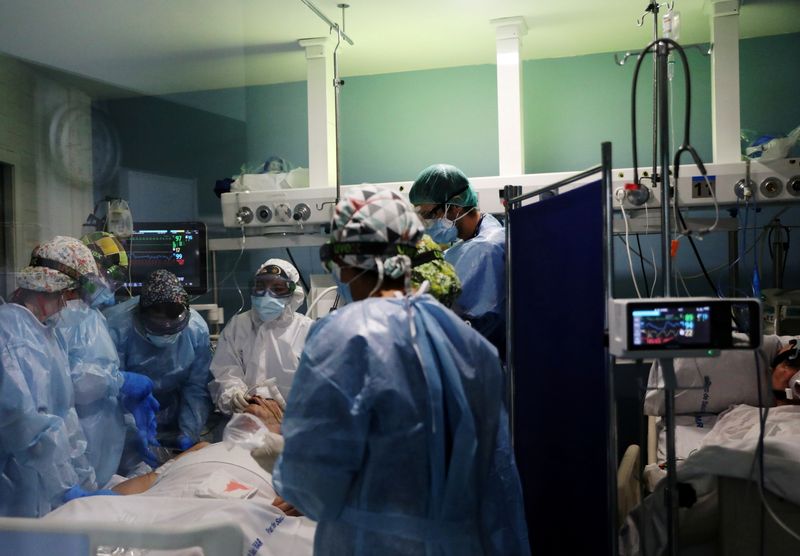 FILE PHOTO: Hospital staff treat patients suffering from coronavirus disease