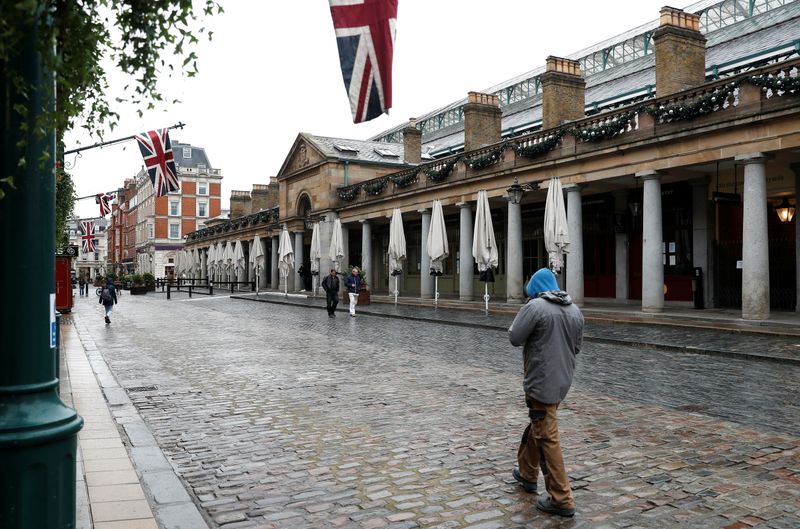 A man walks through Covent Garden amid the coronavirus disease