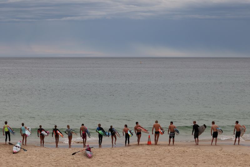 Youths prepare to enter the ocean at Bondi Beach in