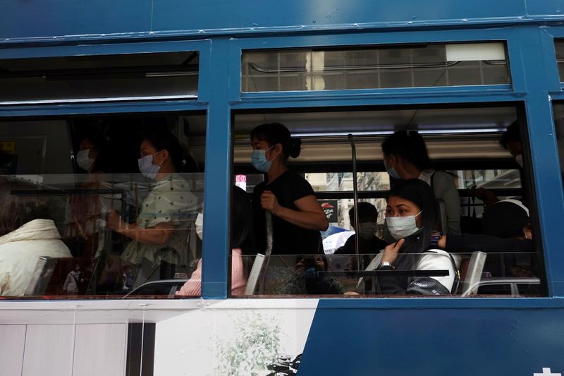 Passengers ride a tram in Hong Kong