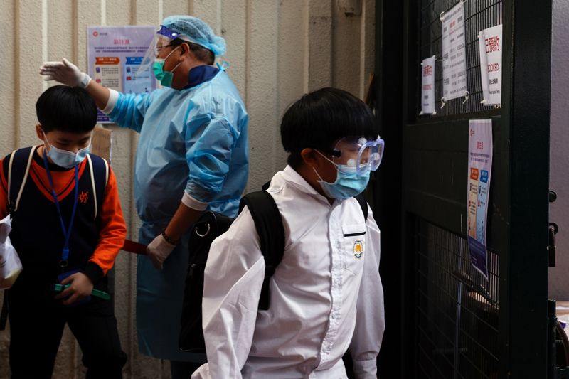 Students enter into a makeshift community testing centre for the