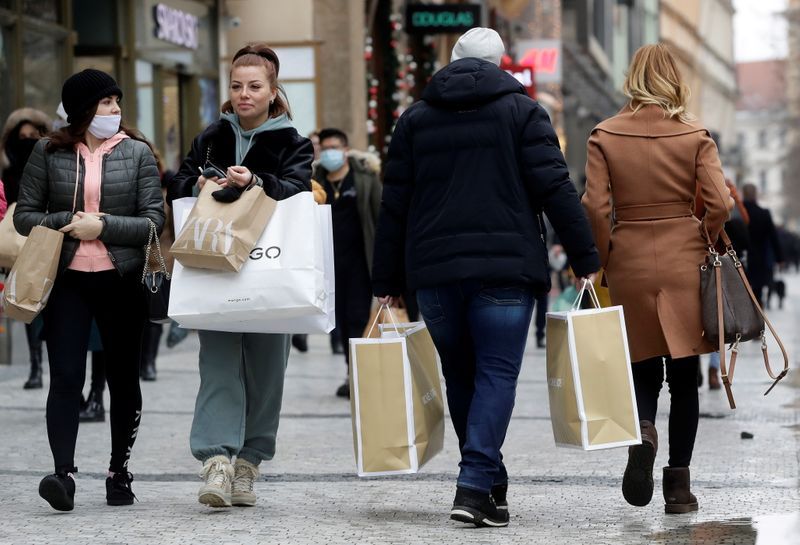 Customers at re-opened shops as restrictions ease in Prague