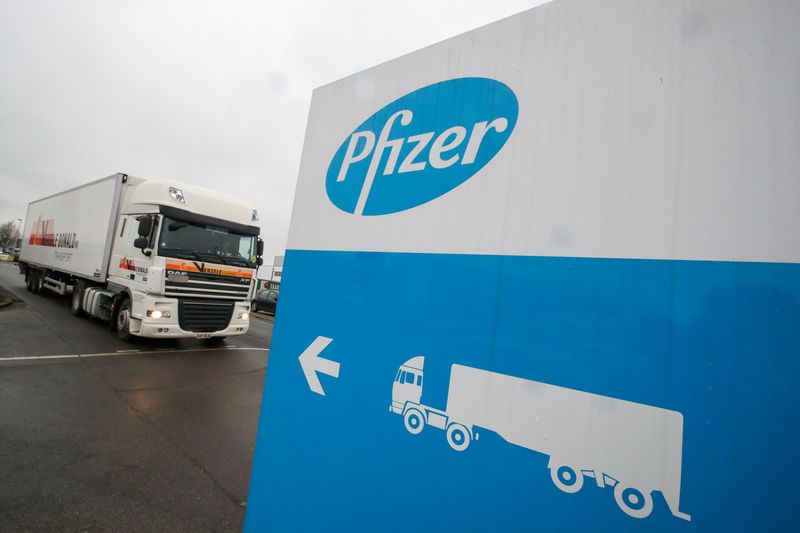 FILE PHOTO: A refrigerated truck leaves the Pfizer plant in