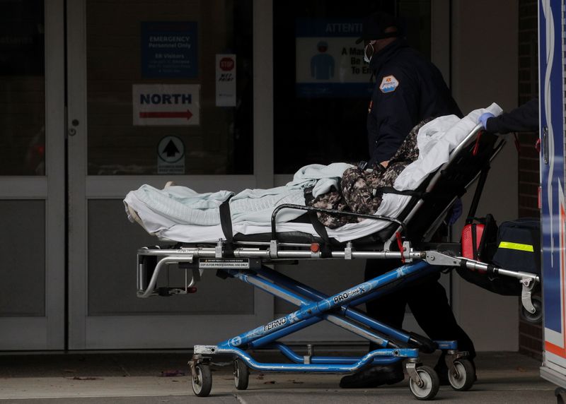 A patient arrives outside Maimonides Medical Center, as the spread