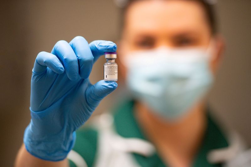 A nurse holds a phial of the Pfizer/BioNTech COVID-19 vaccine