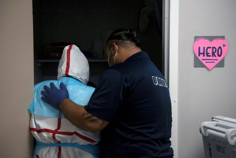 FILE PHOTO: Healthcare personnel work inside a COVID-19 unit in