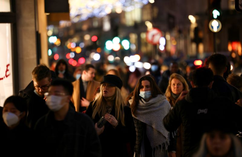 FILE PHOTO: People walk along Regent Street, amid the coronavirus