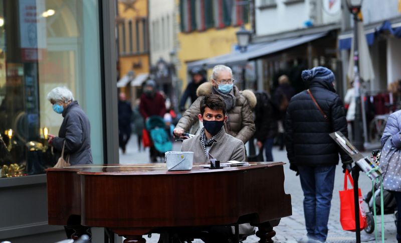A musician plays his mobile piano at a pedestrian zone