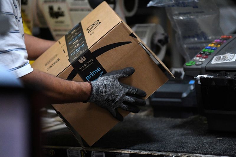FILE PHOTO: FILE PHOTO: Worker assembles a box for delivery