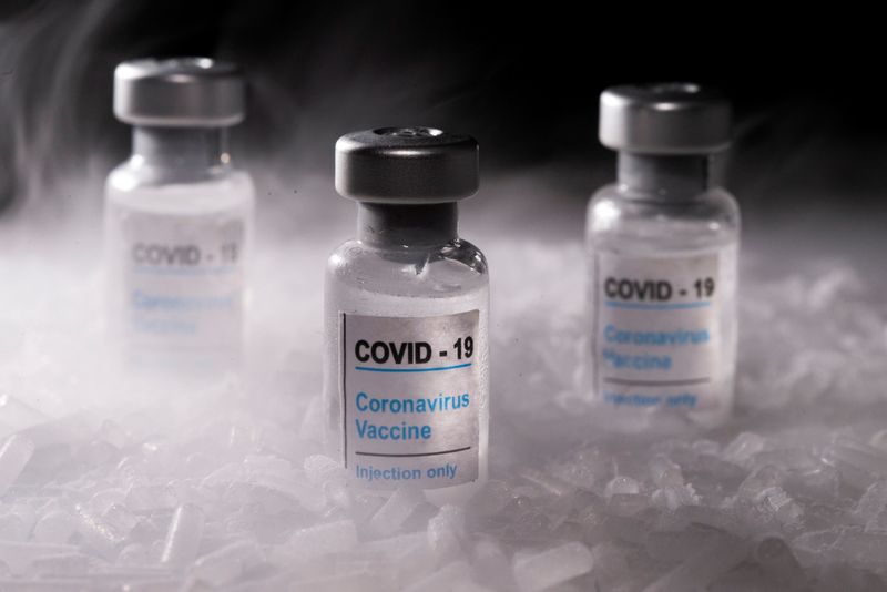 FILE PHOTO: Vials labelled “COVID-19 Coronavirus Vaccine” are placed on