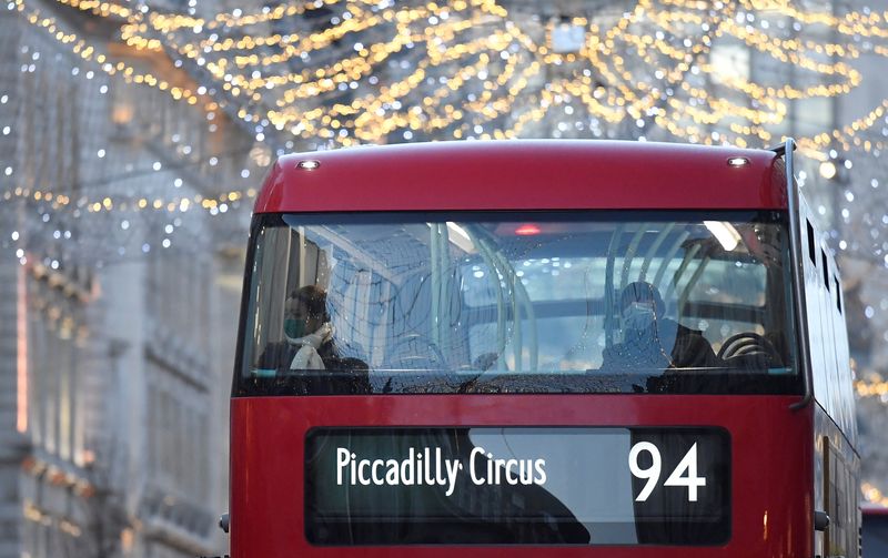 Bus passengers look out at Christmas lights ahead of new