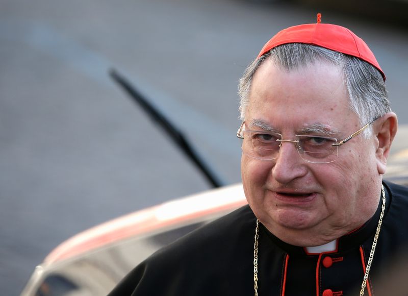 Italian Cardinal Bertello arrives for a meeting at the Synod