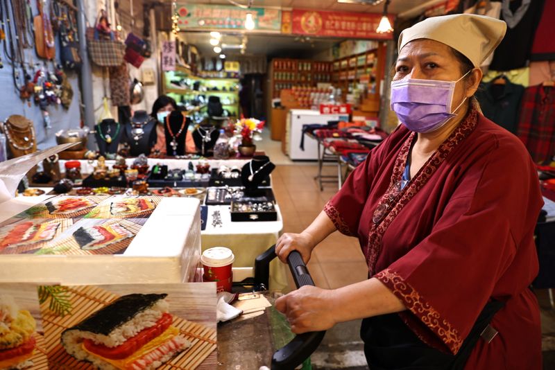 A woman wears a protective mask to prevent the spread
