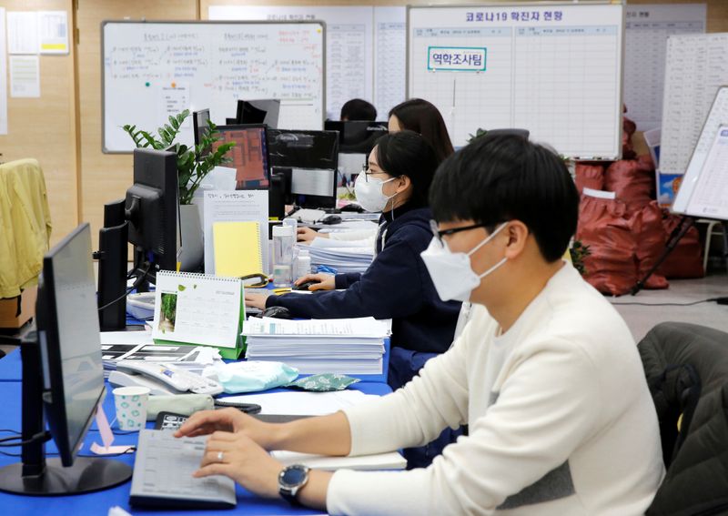 City employees work at Incheon city’s coronavirus response command center