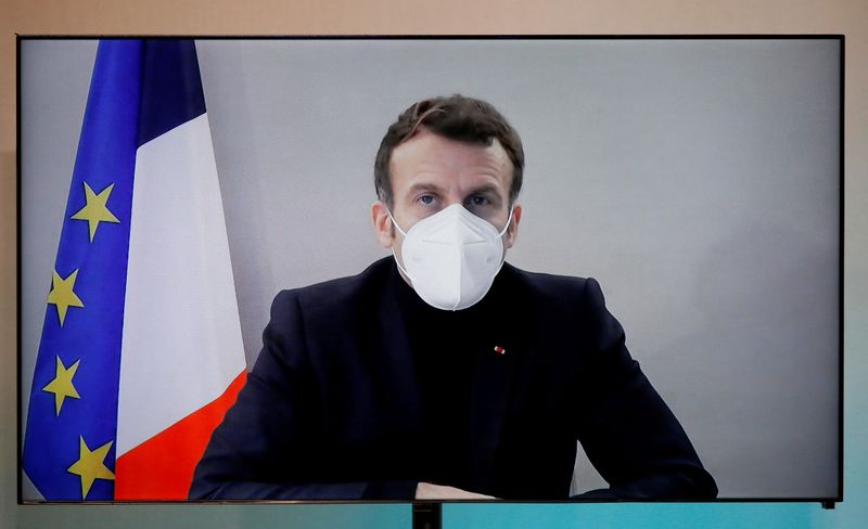 FILE PHOTO: French President Macron, tested positive for coronavirus, talks