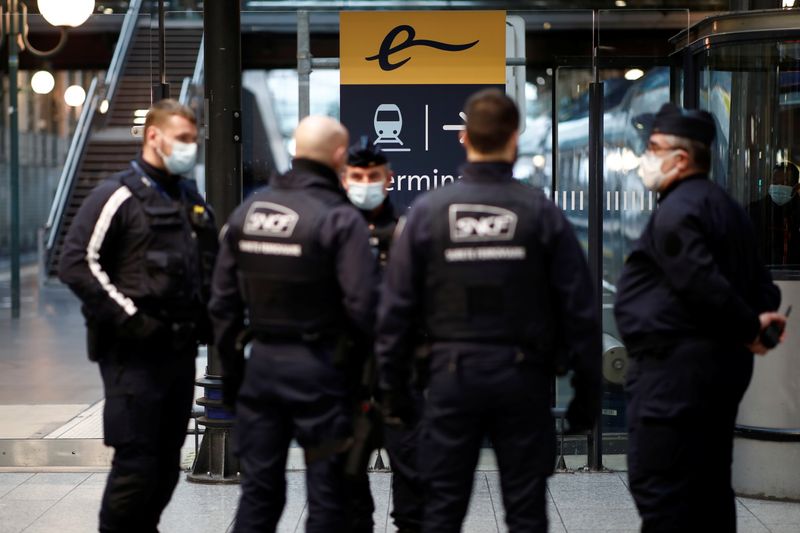 Police officers and security personnel are seen at the Eurostar