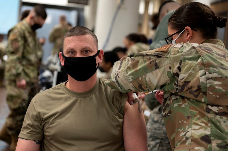 A U.S. Air Force soldier gets a coronavirus disease (COVID-19)