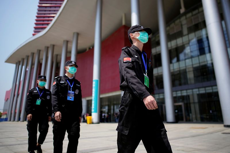 Security personnel patrol outside a convention center that was used
