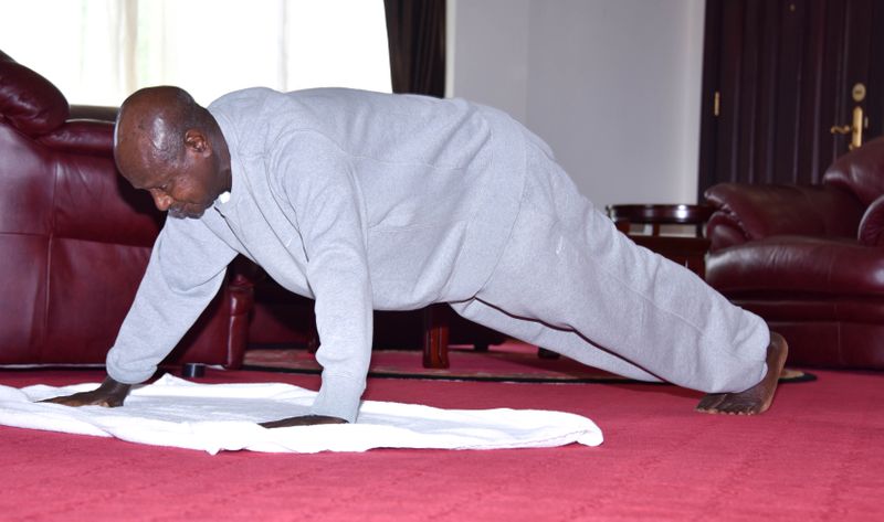 Uganda’s President Yoweri Museveni, does push-ups to keep fit at